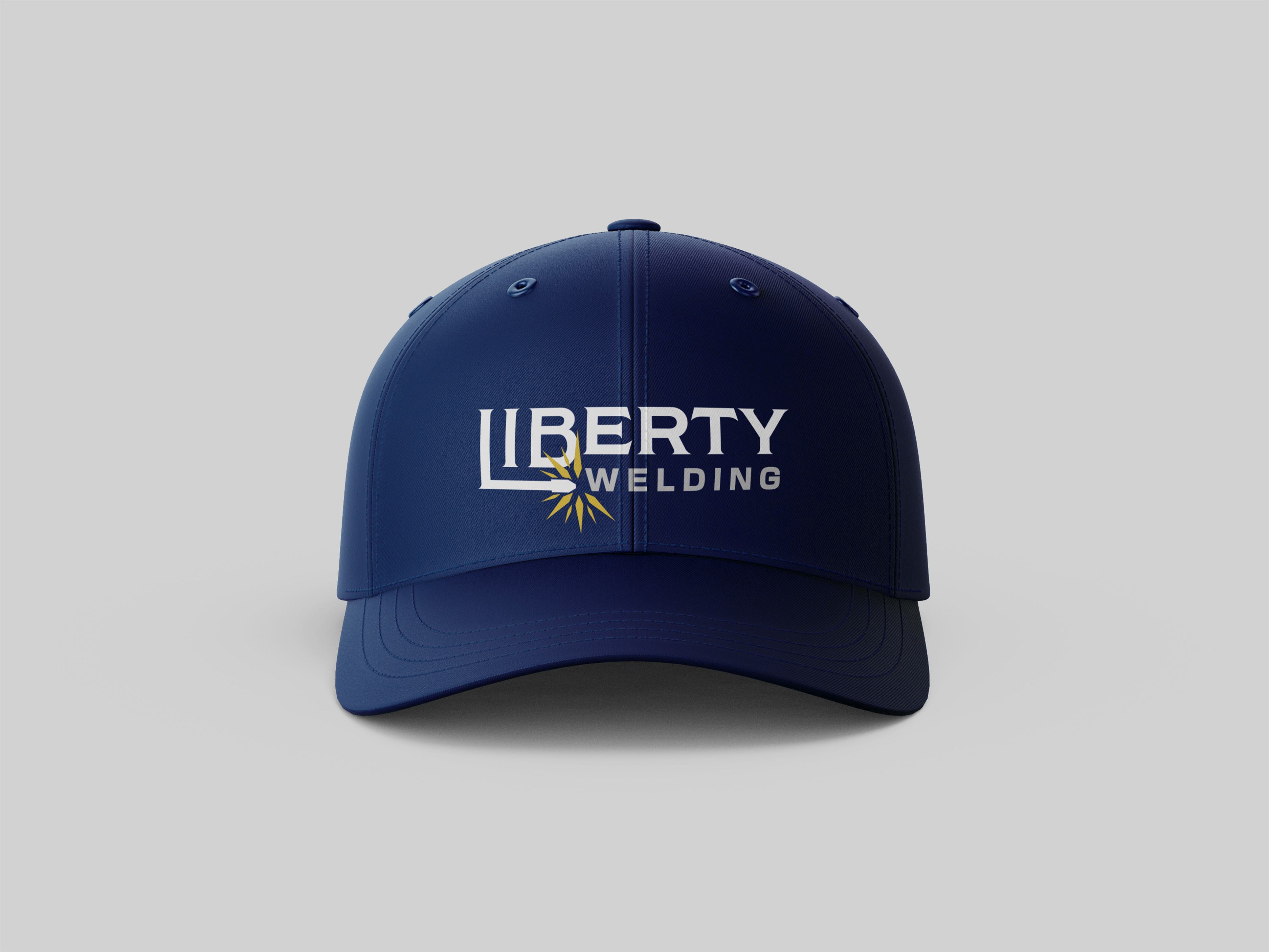 A dark blue cap with the Liberty Welding logo across the front.